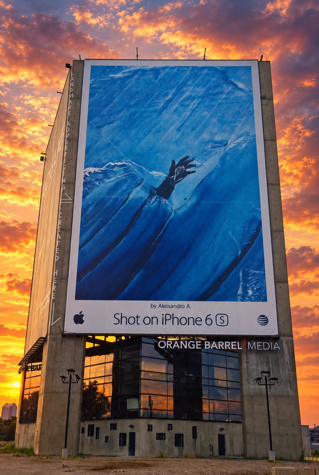 Towering building with a multi-story printed photographic graphic installed on its facade