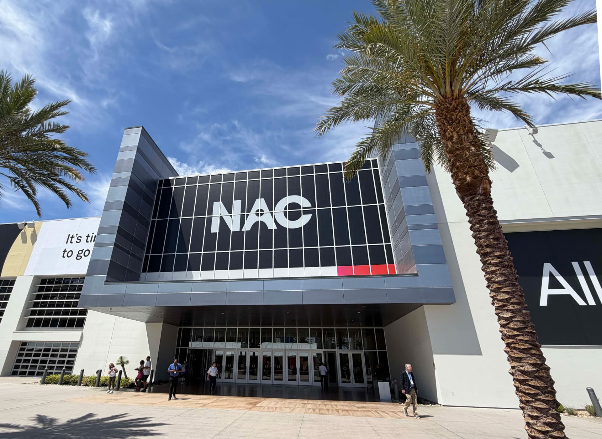 Building entrance with large exterior identity graphics integrated into the facade
