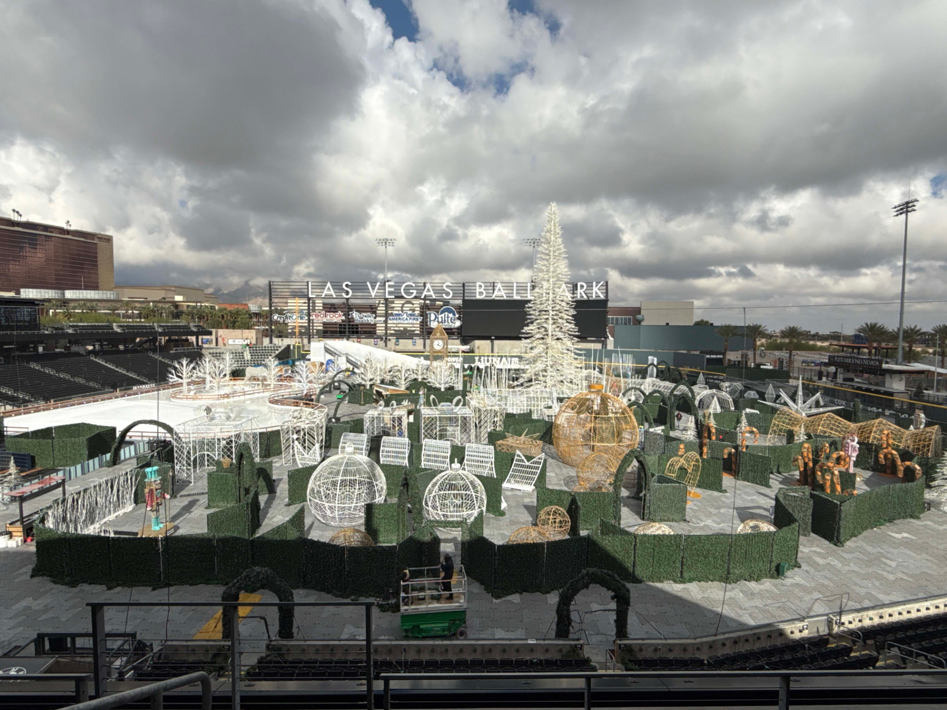 Elevated view across a ballpark transformed into a large seasonal event site