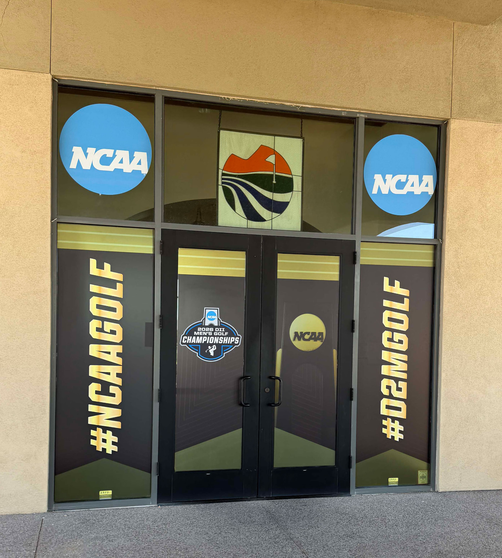 Entry doors and windows covered with coordinated event graphics