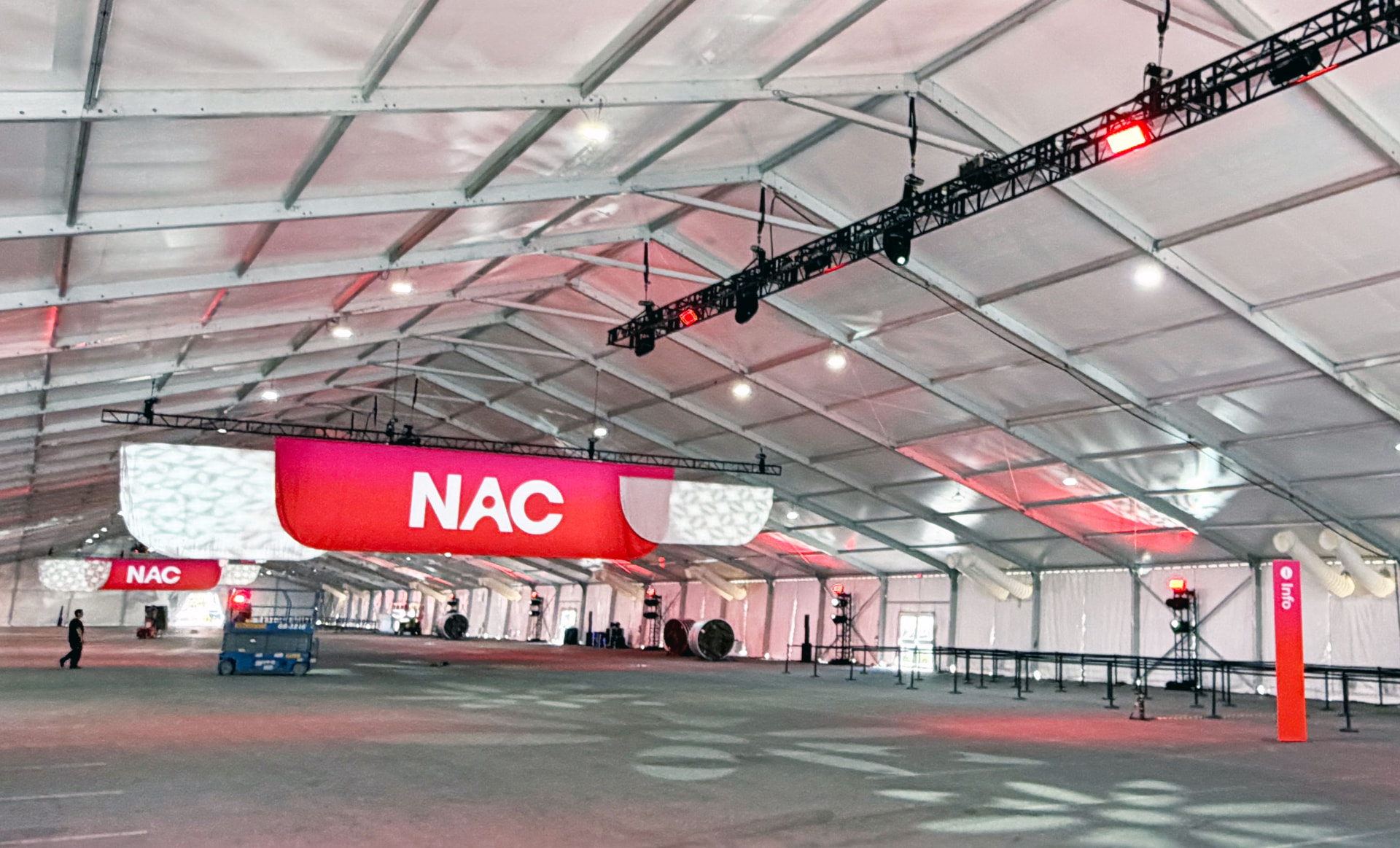 Interior of a large event structure with suspended branded graphics