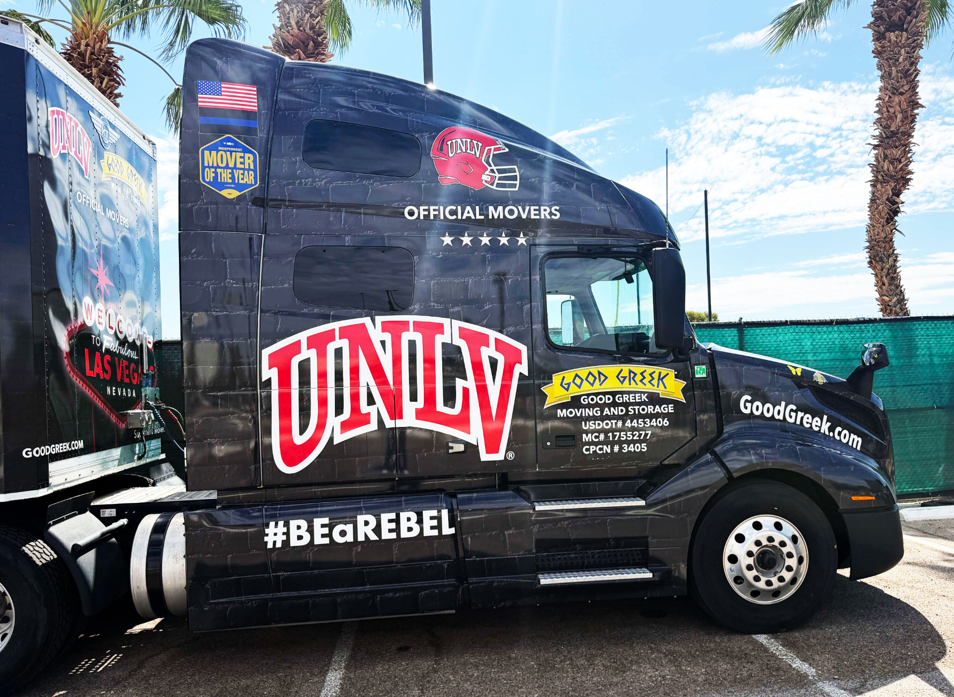 Close view of a semi-truck cab wrapped in bold graphics