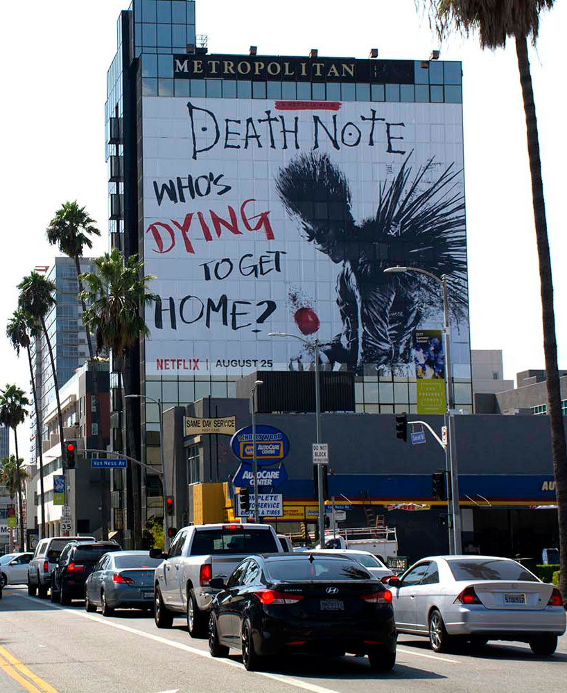 Large printed wrap covering the side of a building