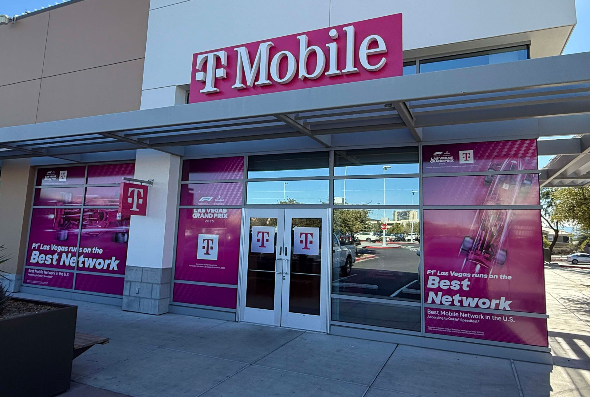Magenta printed window graphics covering a retail storefront