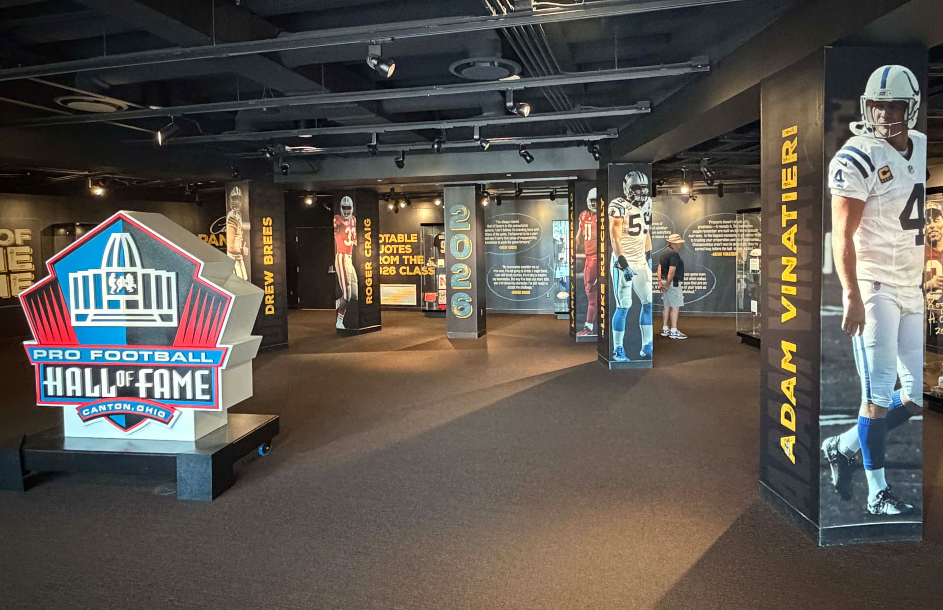 Museum environment with branded walls, graphic columns and dimensional display elements